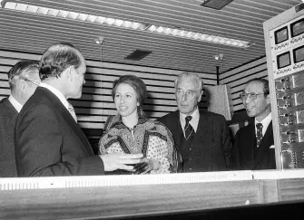 Princess Anne, Run Run Shaw and others. A group of people stood in conversation.