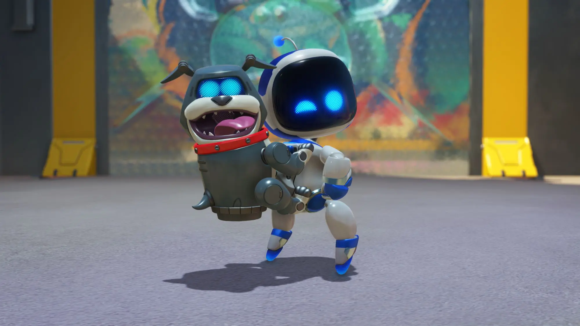 A white square faced robot with blue trim holding a grey robot dog and winking.