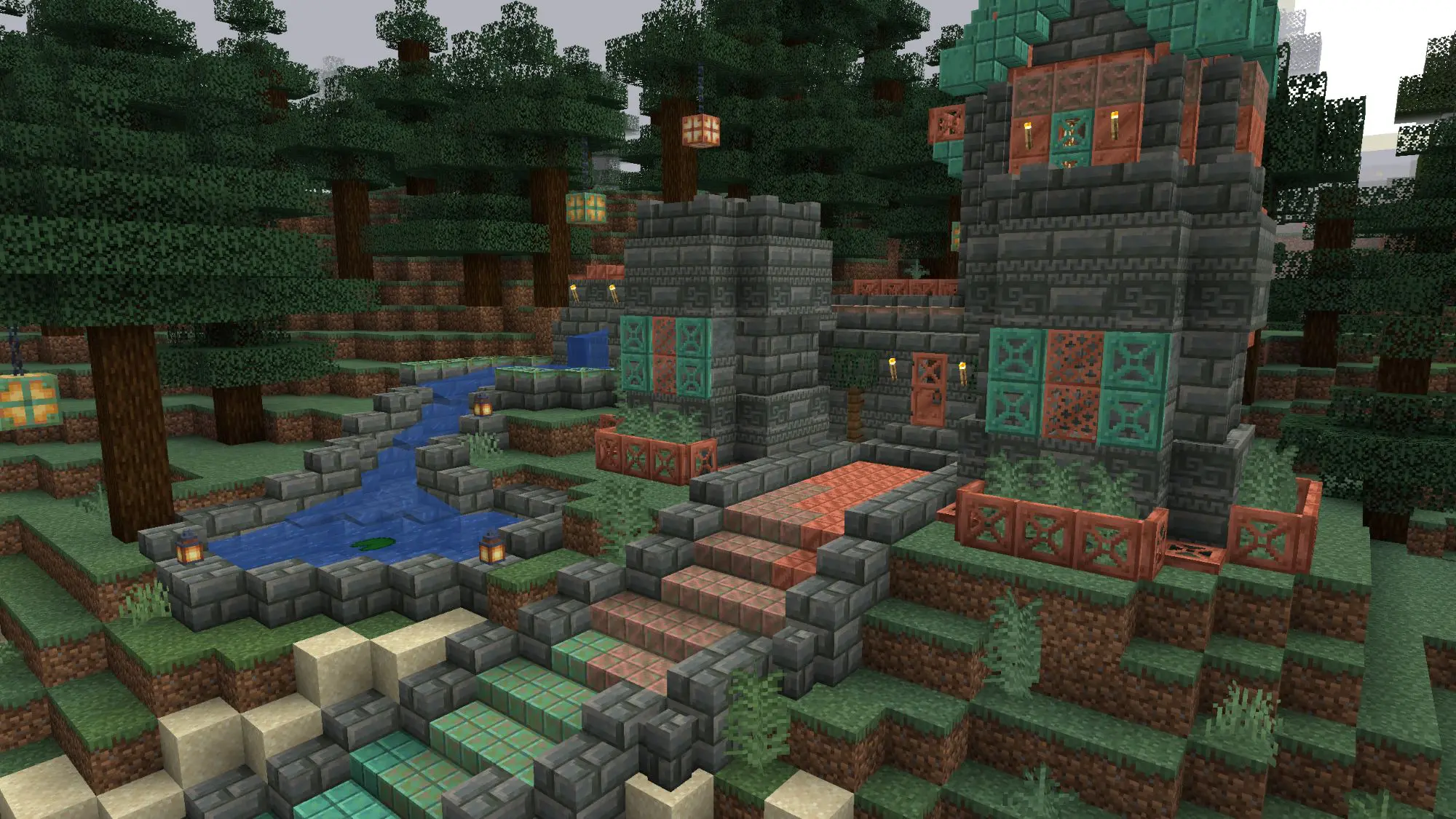 A woodland clearing with steps made of blocks with some trees and a waterfall.