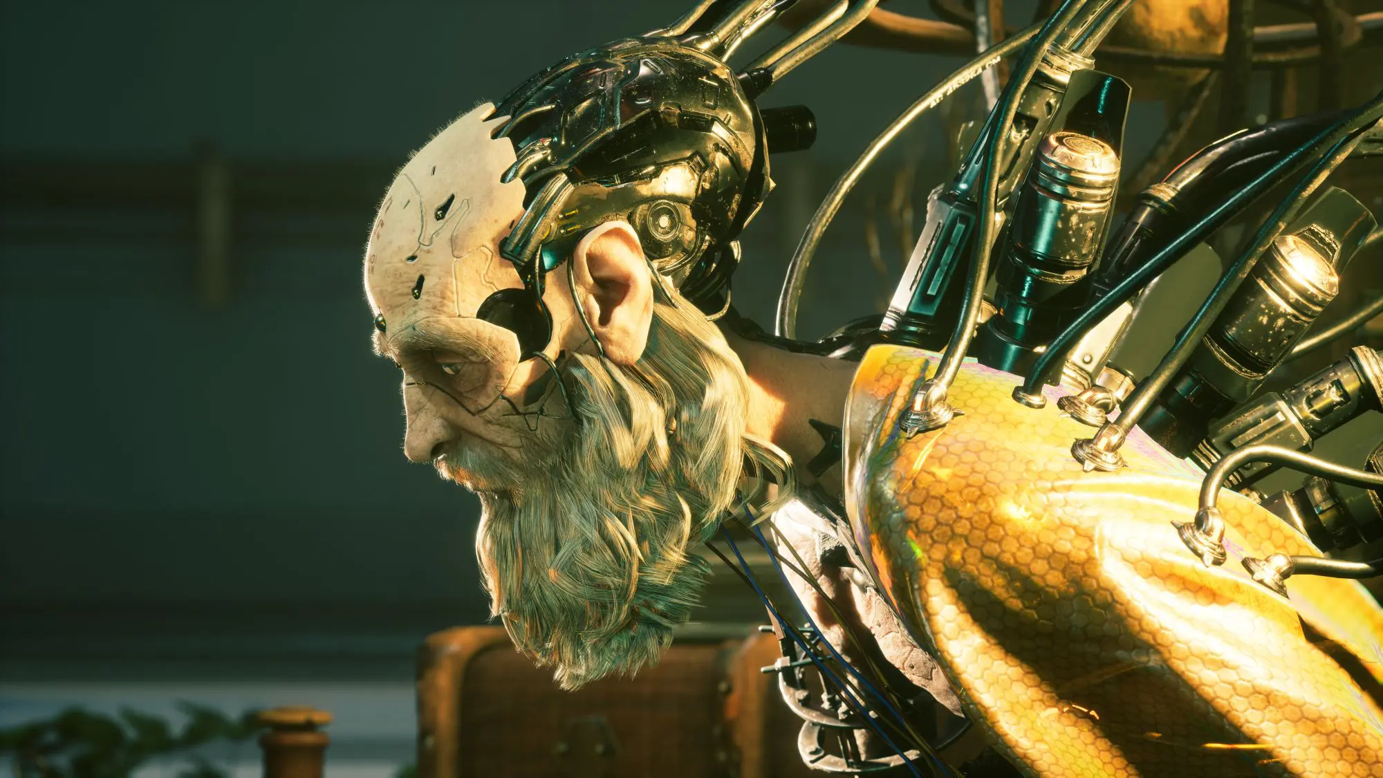 A figure of an old man with a beard leaning forward with tubes and metal plugs coming out of is back. Half his head is is missing skin and shows an exposed metal skull.