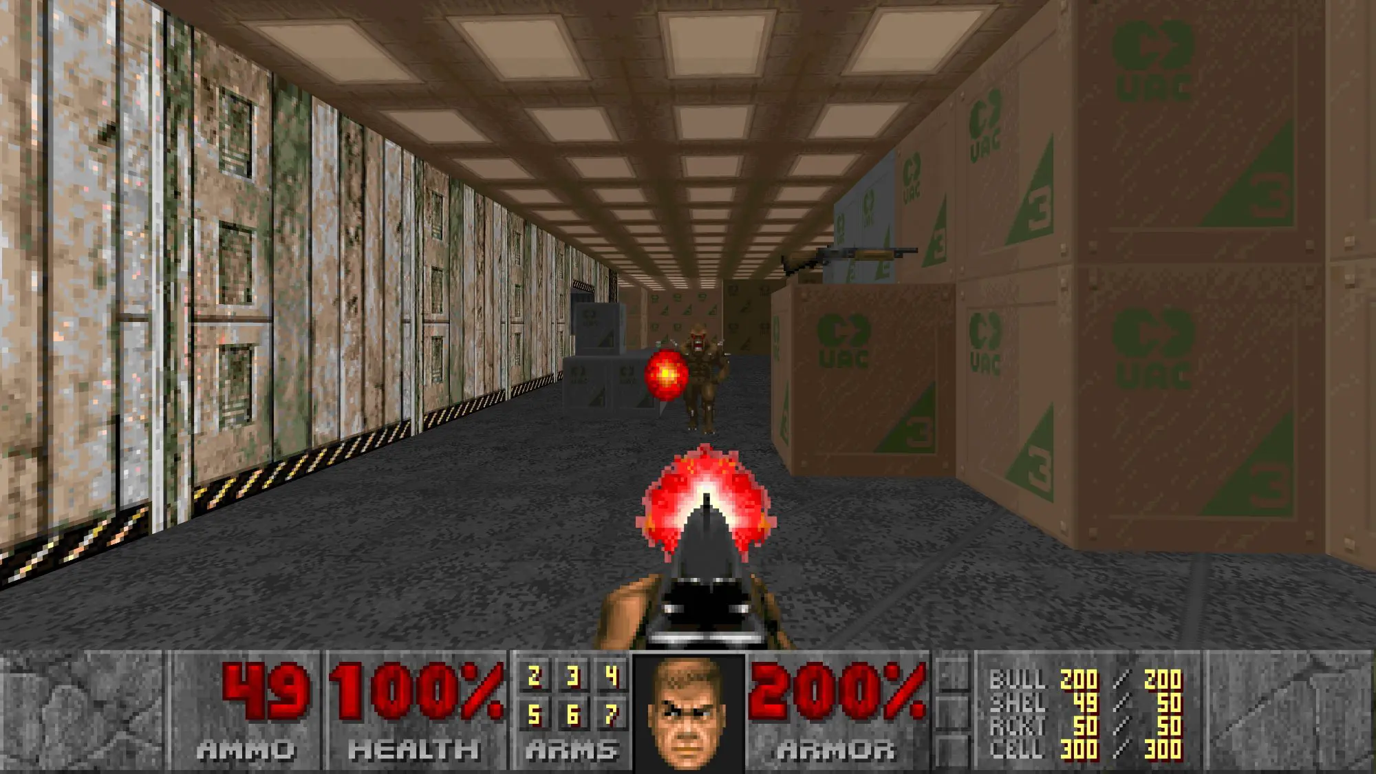 A still from the Doom game. It shows a gun shooting at someone in what looks like a factory.
