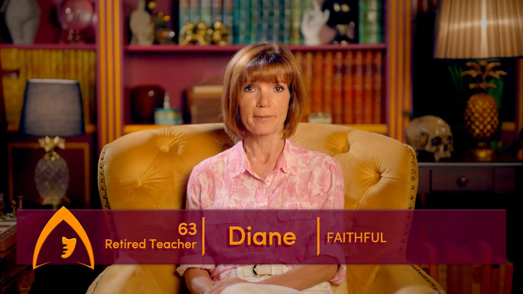 A woman with a dark blonde bob haircut and heavy fringe sat on a large yellow velvet chair. She is wearing a pink patterned shirt and there is an information bar running across the screen saying 'Diane 63, Faithful'.