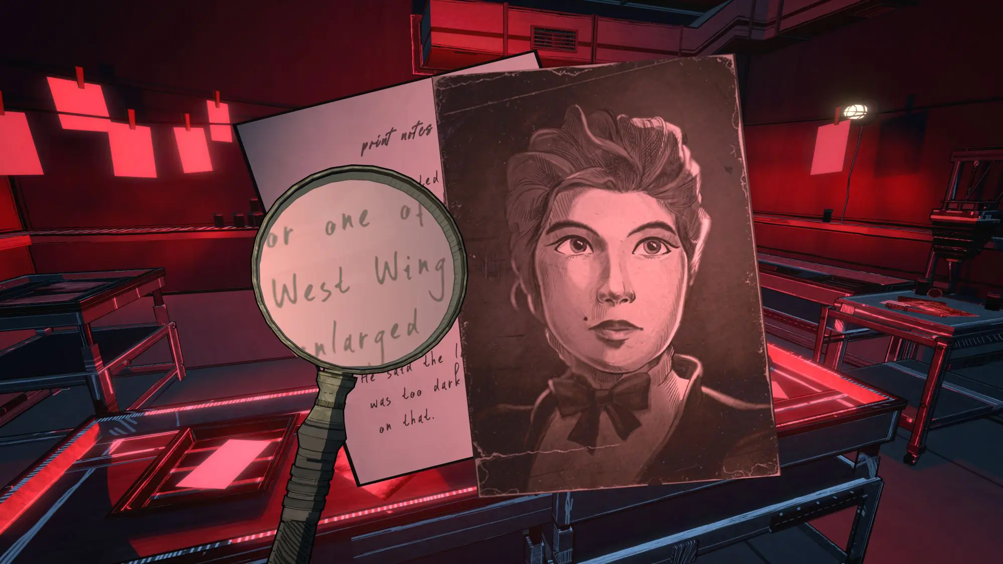 A still from the game Blue Prince. A photographic dark room low lit in re. In the foreground is a black and white Victorian style image of a woman and a magnifying glass hovering over a piece of paper highlighting the words 'West Wing'.